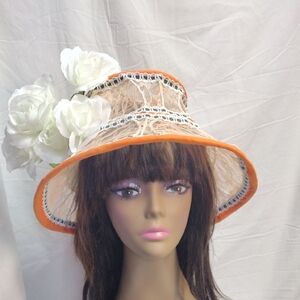 Chic Women's Hat with Orange Trim and White Floral Accents